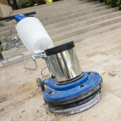 Close up blue polishing machine on the stone floor